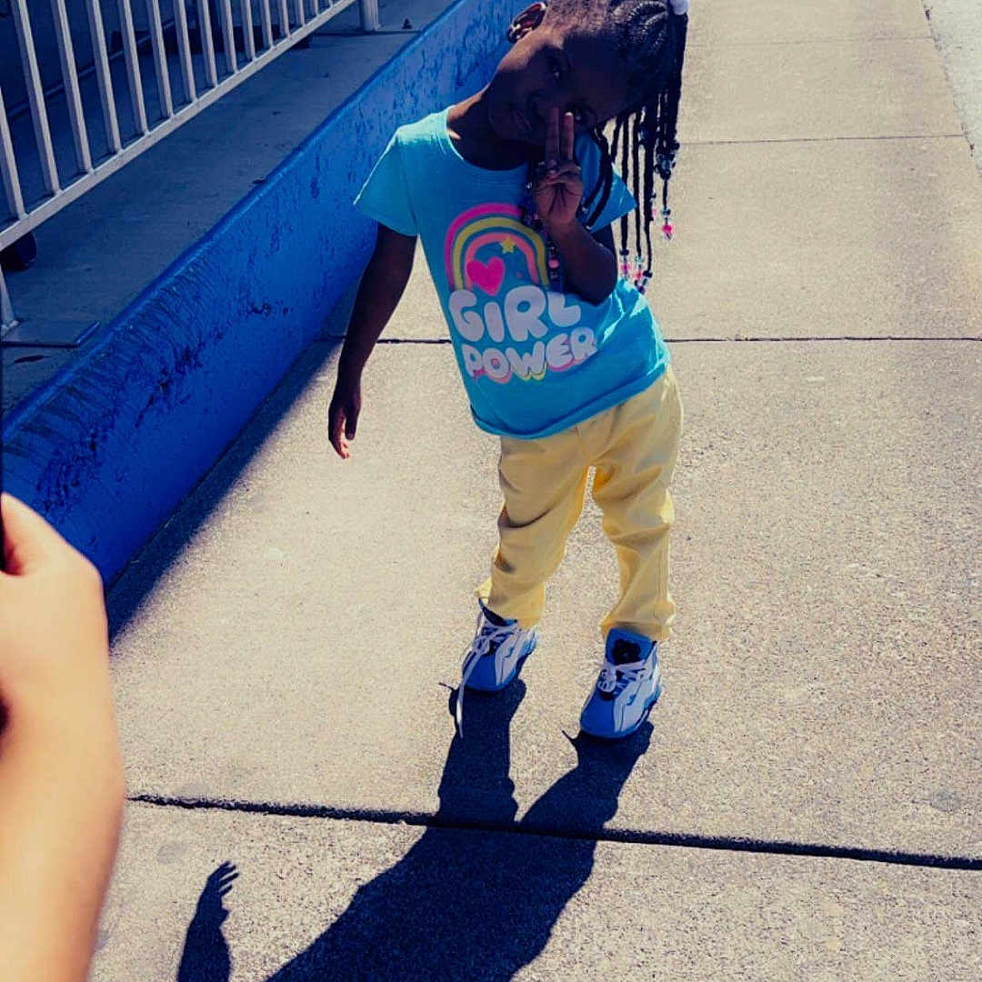 Darionna joined the competition — help win amazing prizes! boy, child, city, clothing, face, footwear, head, pants, path, people, person, photography, portrait, road, shoe, sidewalk, street, t_shirt, urban, walking