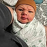 Ajdin joined the competition — help win amazing prizes! baby, infant, child, wrapped, blanket, cap, face, expression, indoor, cushion, pattern, fabric, person, portrait, closeup, holding, soft, cute, newborn, cozy