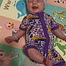 Sadie is registered to the contest to win money with this photo: animal_print, baby, child, colorful, cute, face, floor, foot, hand, hannah_montana, happy, headband, indoors, infant, lying_down, onesie, play_mat, purple_bow, skin, smiling