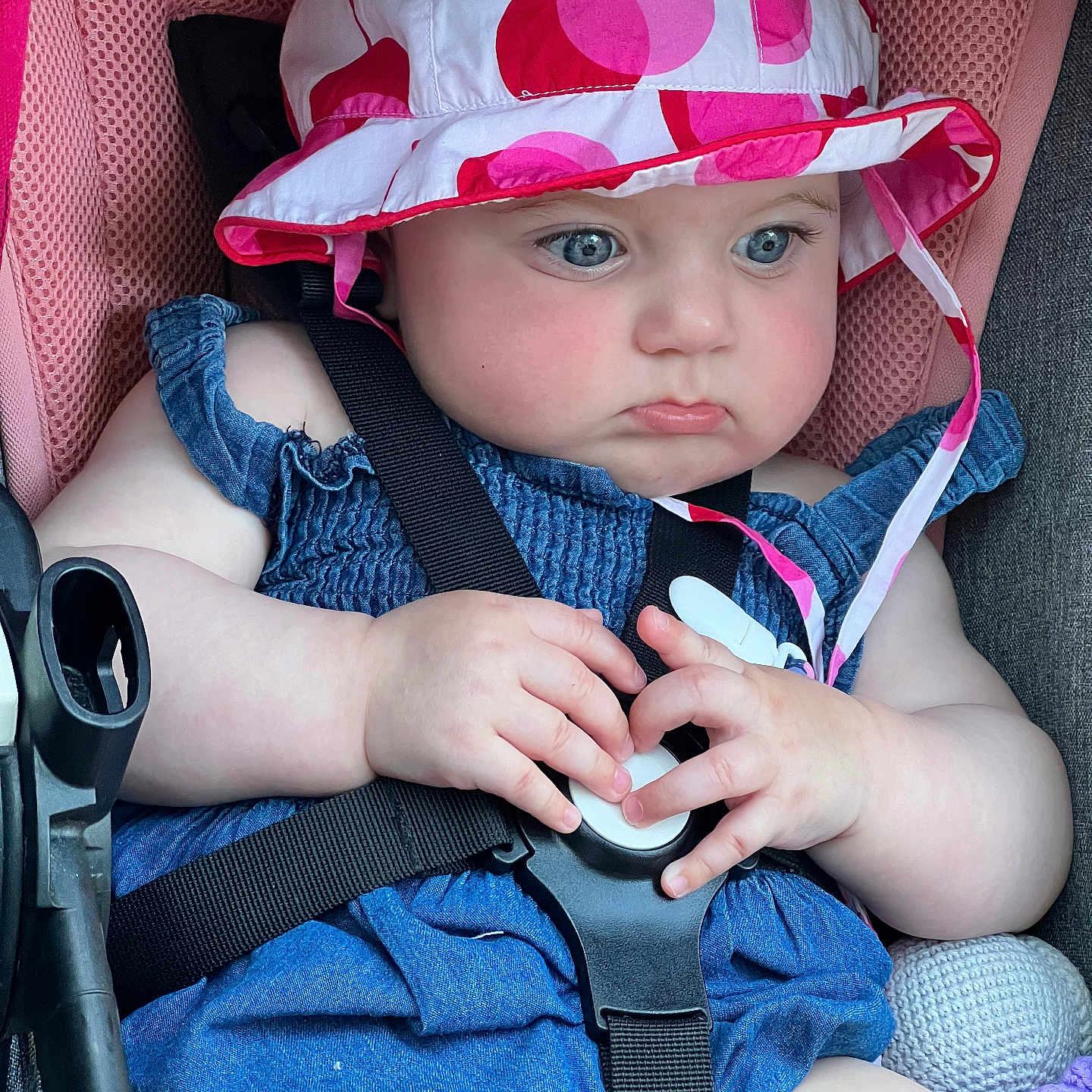Emma is registered to the contest to win money with this photo: accessories, baby, bodypart, cap, clothing, coat, face, finger, gun, hand, hat, head, helmet, pants, person, photography, portrait, sunhat, tape, weapon