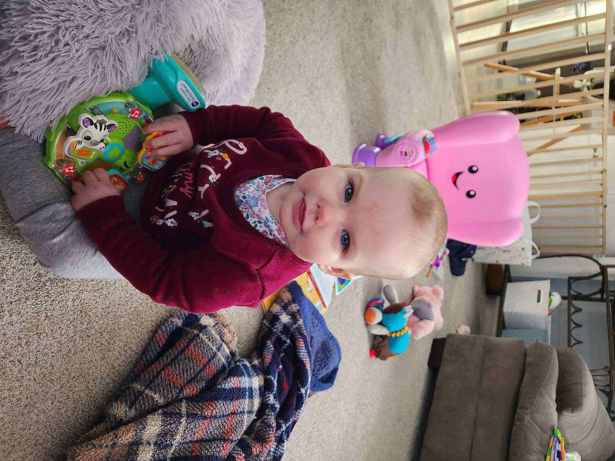 Lily is registered to the contest to win money with this photo: baby, baby_toddler_clothing, child, costume, fun, happy, hat, headgear, pattern, person, plaid, play, smile, tartan, toddler, tree, vacation, wood