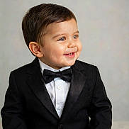 Mateo joined the competition — help win amazing prizes! black_jacket, bow_tie, boy, buttoned_shirt, child, cute, face, formal_wear, hair, happy, indoor, light_background, person, portrait, smile, studio_shot, suit, toddler, tuxedo, young_child