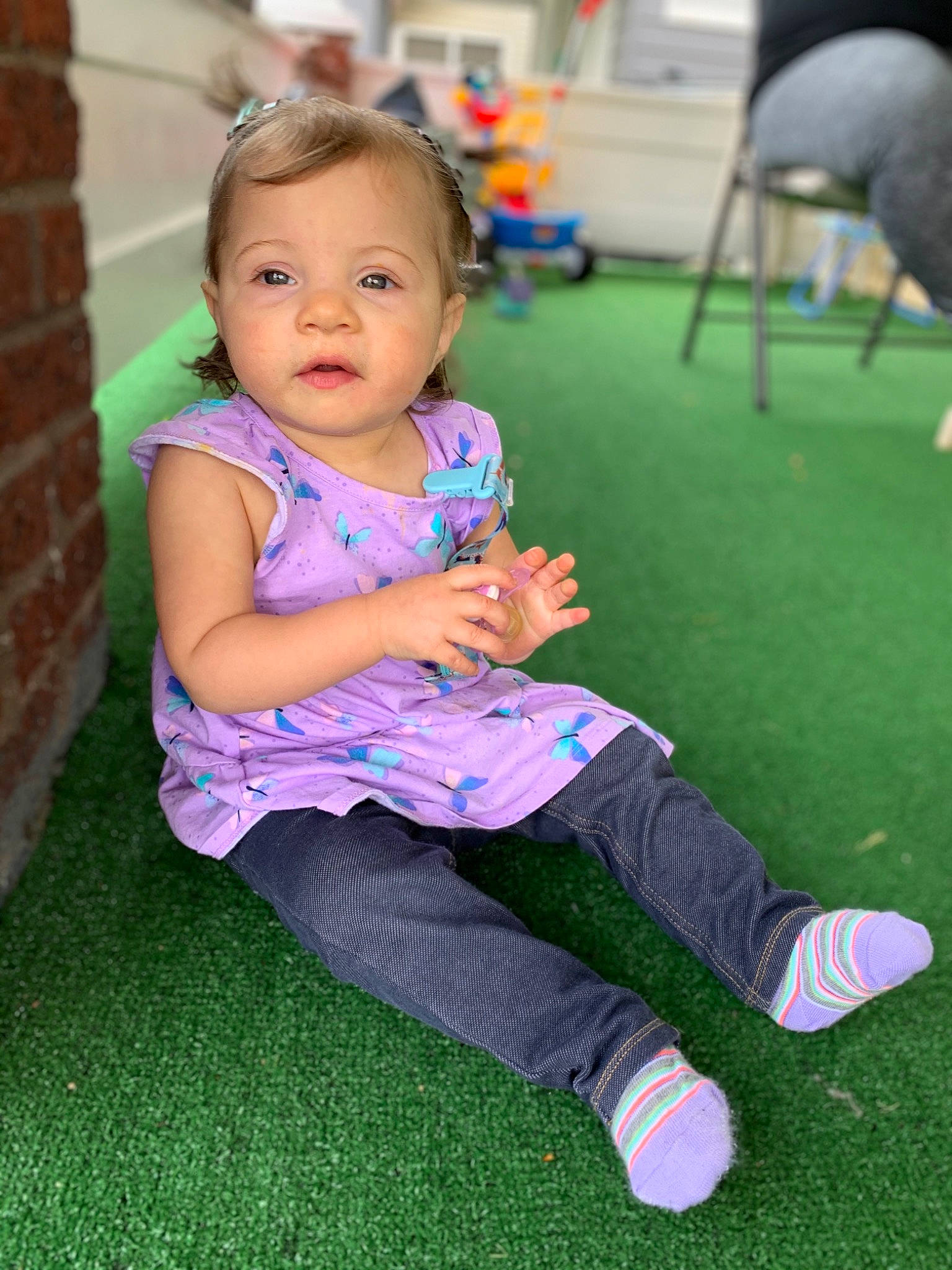 Amiah joined the competition — help win amazing prizes! baby, beauty, cheek, child, eye, grass, iris, leisure, person, pink, plant, play, purple, recreation, sitting, skin, smile, toddler, vacation