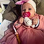 Odessa a rejoint le concours — aidez-le/la à gagner de superbes lots ! baby, blanket, child, closeup, clothing, cushion, cute, face, hand, headband, indoors, infant, pacifier, person, pink, portrait, relaxing, soft_toy, toy, tulle_skirt