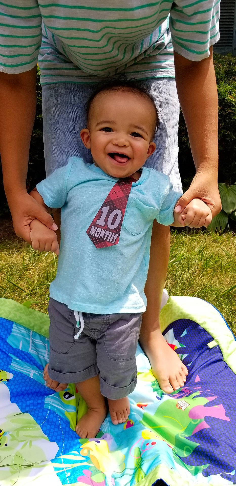 Caden is registered to the contest to win money with this photo: abdomen, baby_products, boy, child, day, facial_expression, fun, girl, grass, green, infant, joy, person, play, product, recreation, sitting, skin, smile, summer
