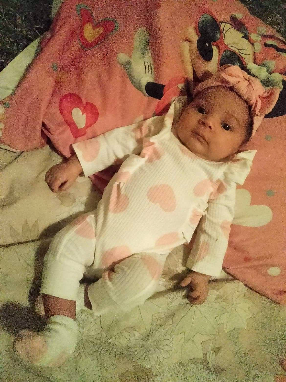 Ixchel joined the competition — help win amazing prizes! baby, baby_products, baby_toddler_clothing, bedtime, cheek, child, comfort, flooring, grass, happy, head, headwear, linens, pattern, person, pink, room, skin, sleeve, textile