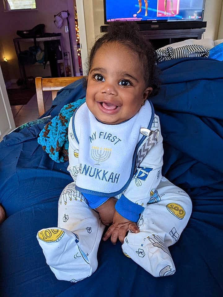 Maxwell joined the competition — help win amazing prizes! baby, baby_toddler_clothing, cable_television, child, display_device, door, flat_panel_display, joy, lcd_tv, led_backlit_lcd_display, martial_arts_uniform, overall, pajamas, person, picture_frame, sleeve, television, television_set, toddler, tooth