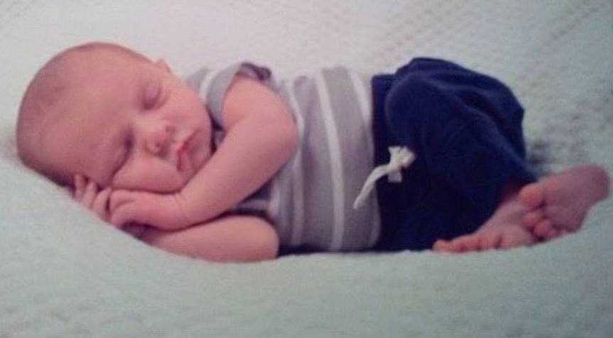 Jordan is registered to the contest to win money with this photo: baby, baby_toddler_clothing, bedtime, child, comfort, elbow, finger, happy, human_body, human_leg, knee, linens, mouth, nap, neck, person, sitting, skin, thigh, thumb