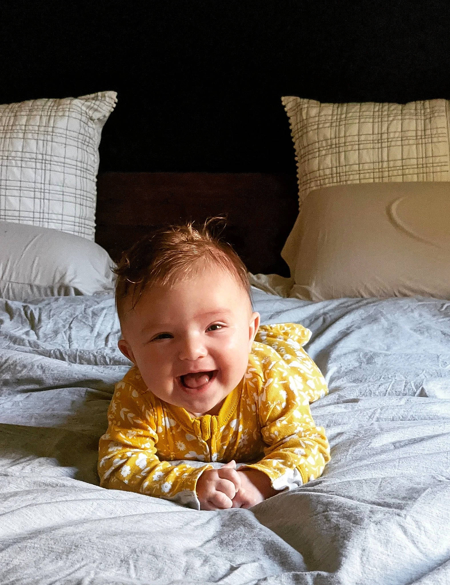 Eleanor joined the competition — help win amazing prizes! baby, baby_toddler_clothing, child, comfort, couch, eye, flash_photography, flooring, furniture, happy, head, light, linens, person, pillow, sleeve, smile, textile, toddler, white