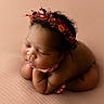 newborn, baby, sleeping, flower_crown, portrait, soft_light, closeup, peaceful, infant, skin, head, hands, resting, cute, adorable, studio, blanket, warm_colors, curly_hair, peace
