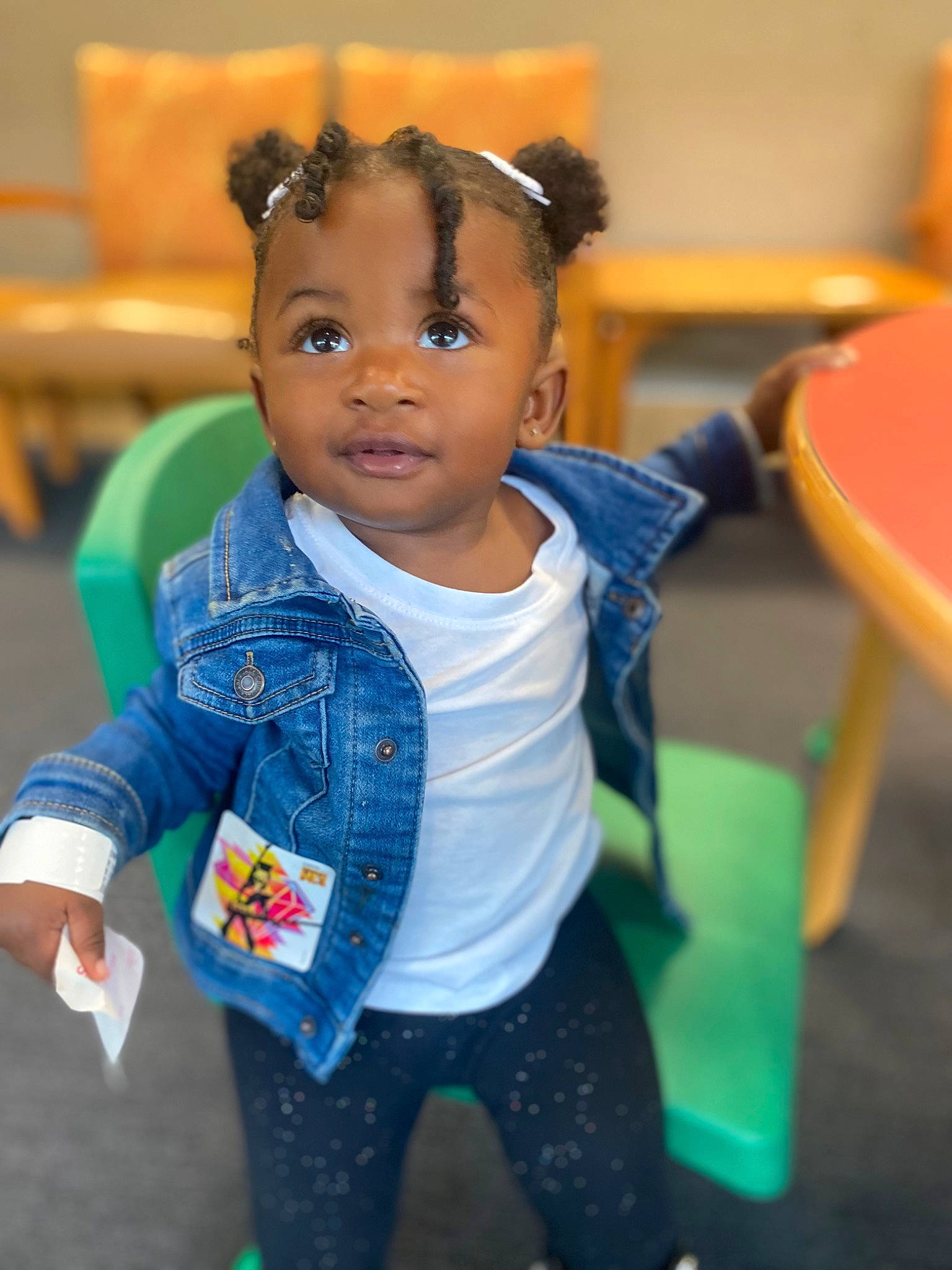 Marcia is registered to the contest to win money with this photo: azure, baby_toddler_clothing, black_hair, cheek, chin, cool, electric_blue, eye, facial_expression, fun, happy, iris, joint, leisure, nose, person, sitting, skin, sleeve, toddler