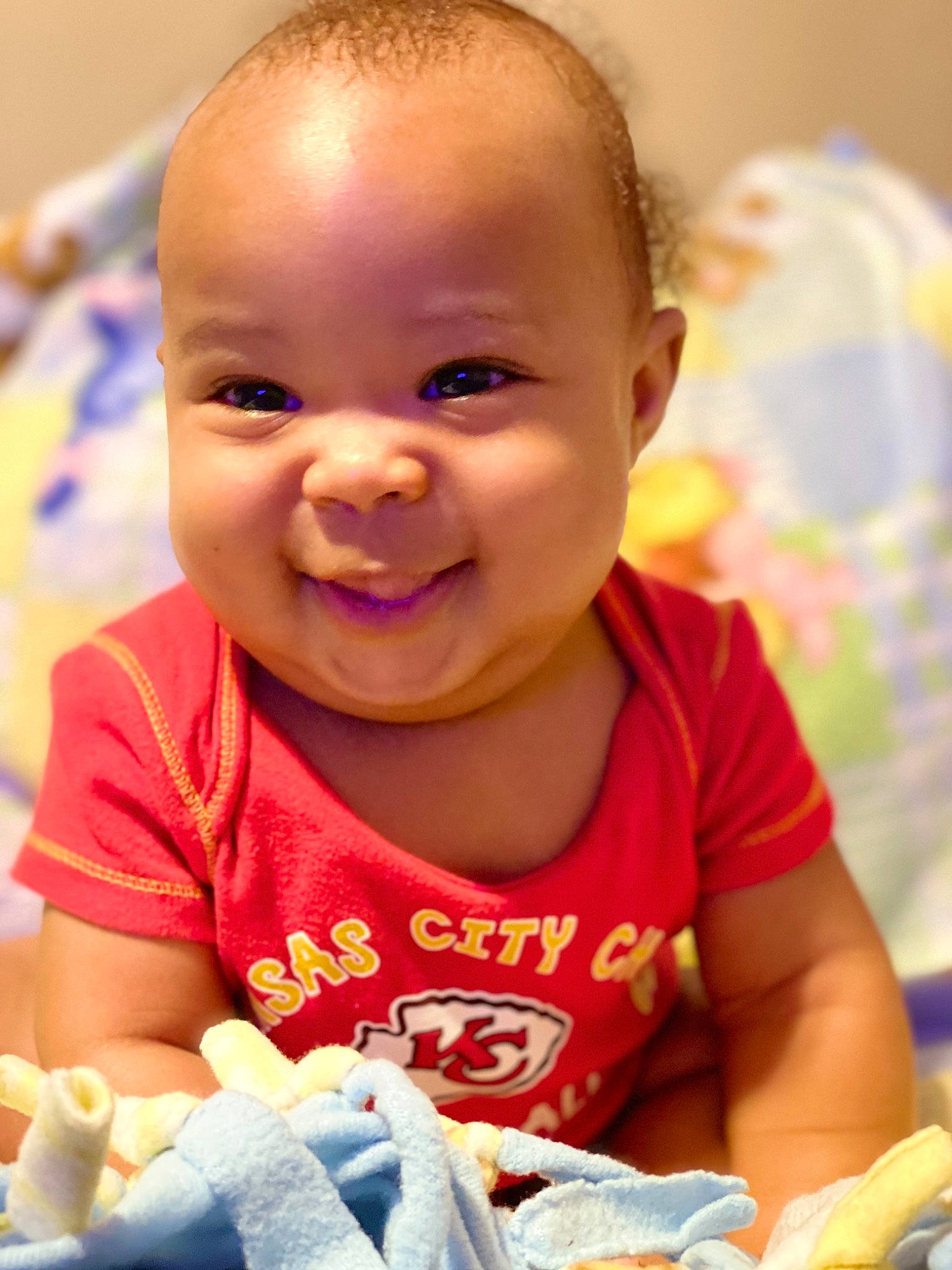 Jaziah is registered to the contest to win money with this photo: baby, cheek, child, face, facial_expression, head, joy, person, play, skin, smile, toddler, tummy_time