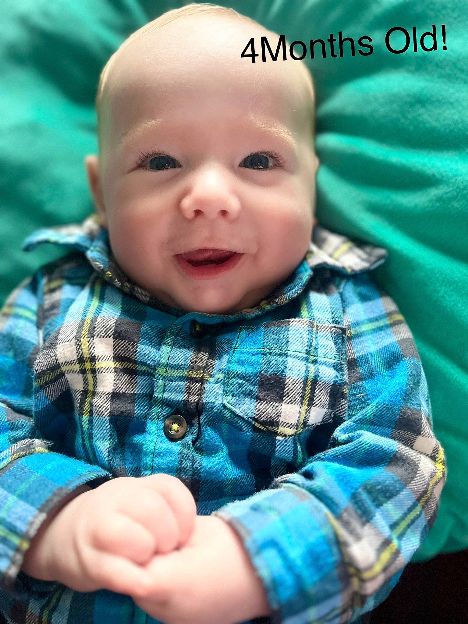 Myles is registered to the contest to win money with this photo: baby, baby_toddler_clothing, cheek, cool, eye, face, gesture, hand, happy, head, iris, nose, pattern, person, plaid, skin, sleeve, smile, t_shirt, tartan