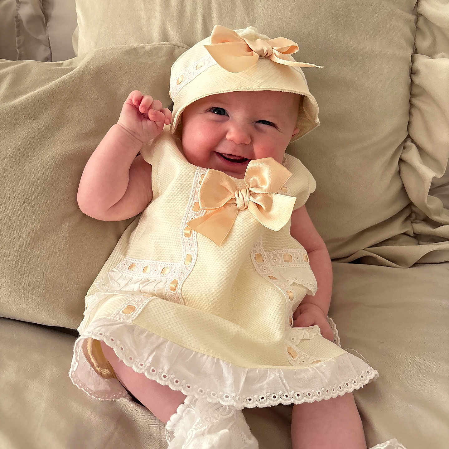 Lilly-Rose joined the competition — help win amazing prizes! baby, beige, bow, child, clothing, cushion, cute, dress, fabric, happy, hat, indoors, infant, lace, person, portrait, sitting, smiling, sock, soft