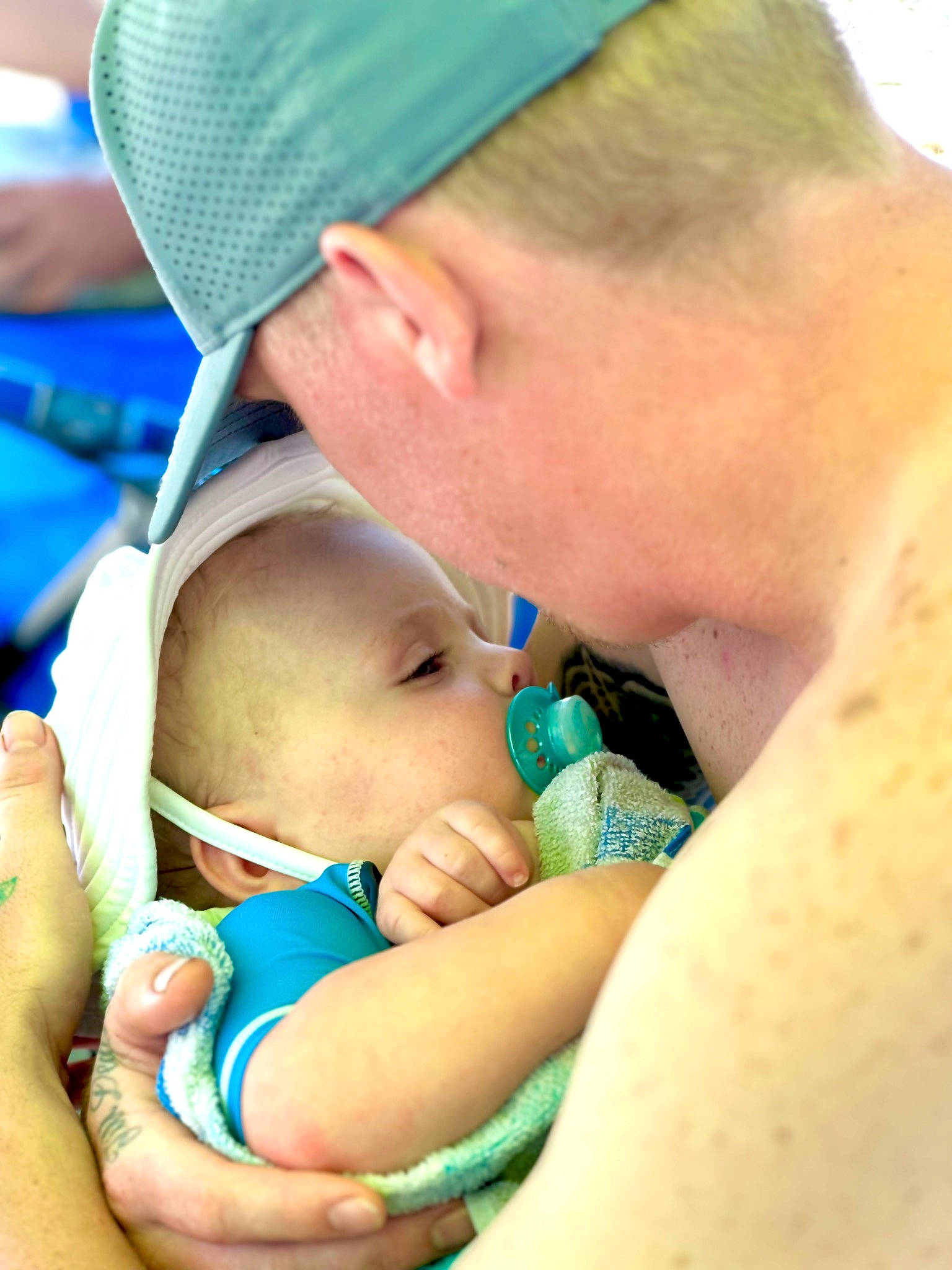 Nash is registered to the contest to win money with this photo: azure, baby, baseball_cap, blue, cap, cheek, child, comfort, finger, gesture, grass, green, hand, happy, hat, people_in_nature, person, product, skin, thumb