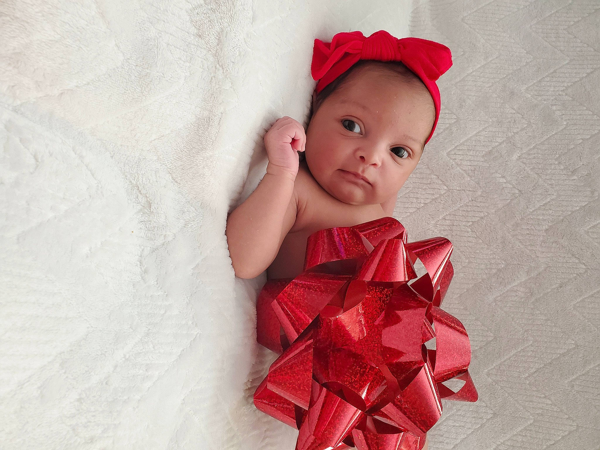 Ansley is registered to the contest to win money with this photo: baby, baby_toddler_clothing, bonnet, child_model, costume, costume_accessory, day_dress, embellishment, hair_accessory, headband, headgear, headpiece, lip, mouth, person, photo_shoot, portrait_photography, red, ribbon, textile