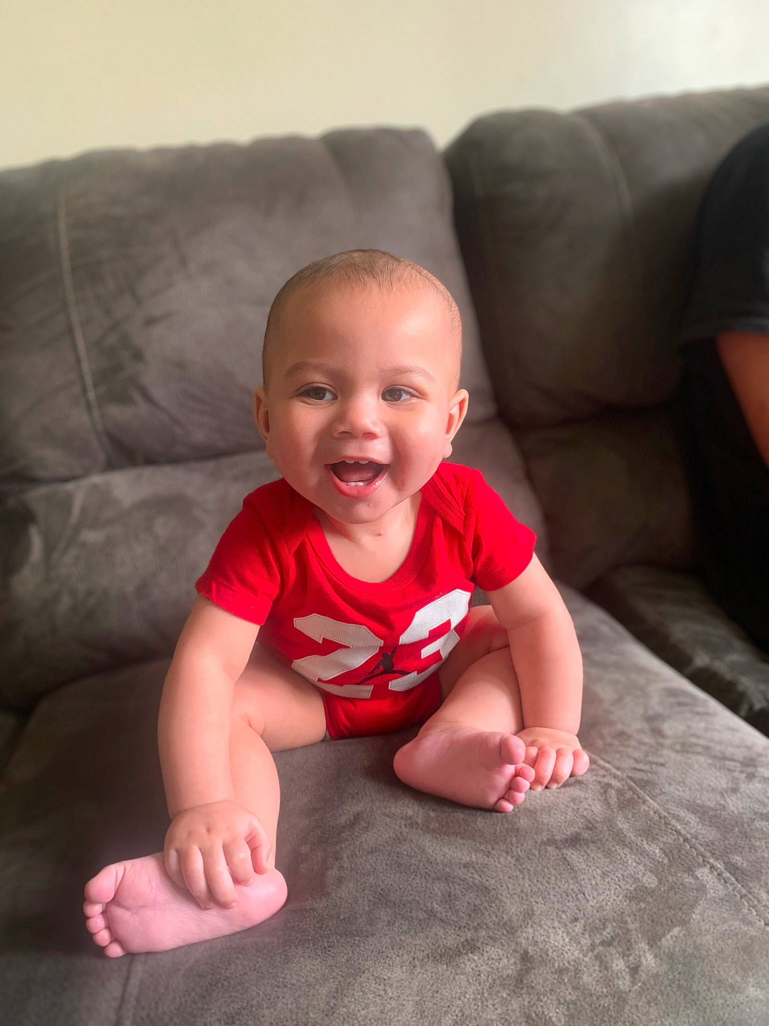 Demitris is registered to the contest to win money with this photo: baby, baby_toddler_clothing, cheek, comfort, eye, face, facial_expression, finger, floor, flooring, happy, head, mouth, nose, person, skin, sleeve, smile, standing, textile