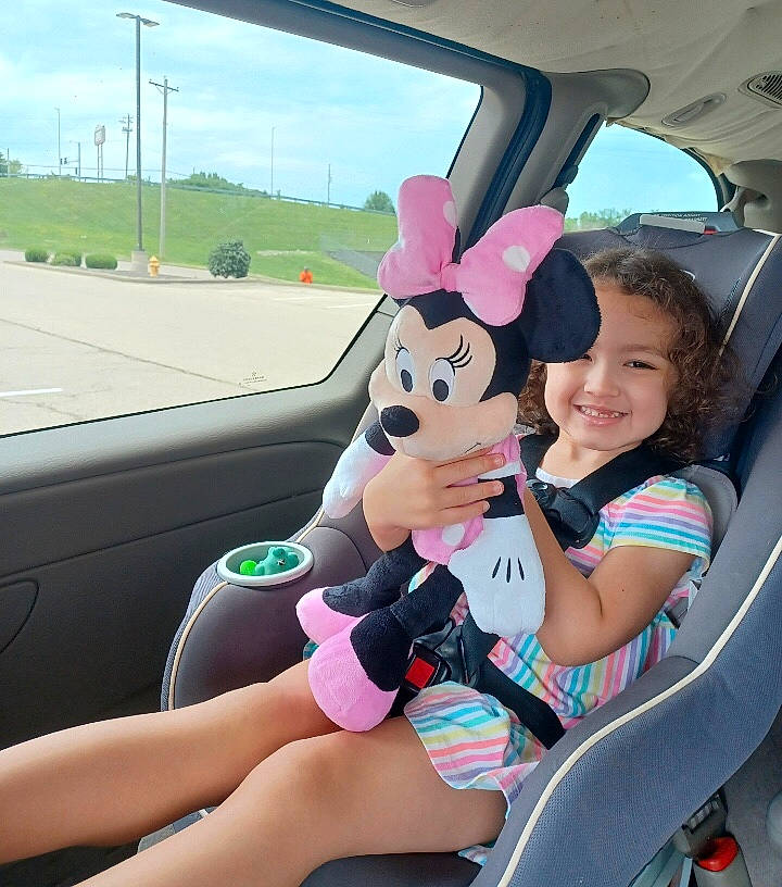 Kya is registered to the contest to win money with this photo: auto_part, automotive_design, automotive_exterior, automotive_mirror, car, car_seat, car_seat_cover, happy, joy, land_vehicle, leisure, mode_of_transport, motor_vehicle, person, pink, sky, smile, steering_part, steering_wheel, thigh