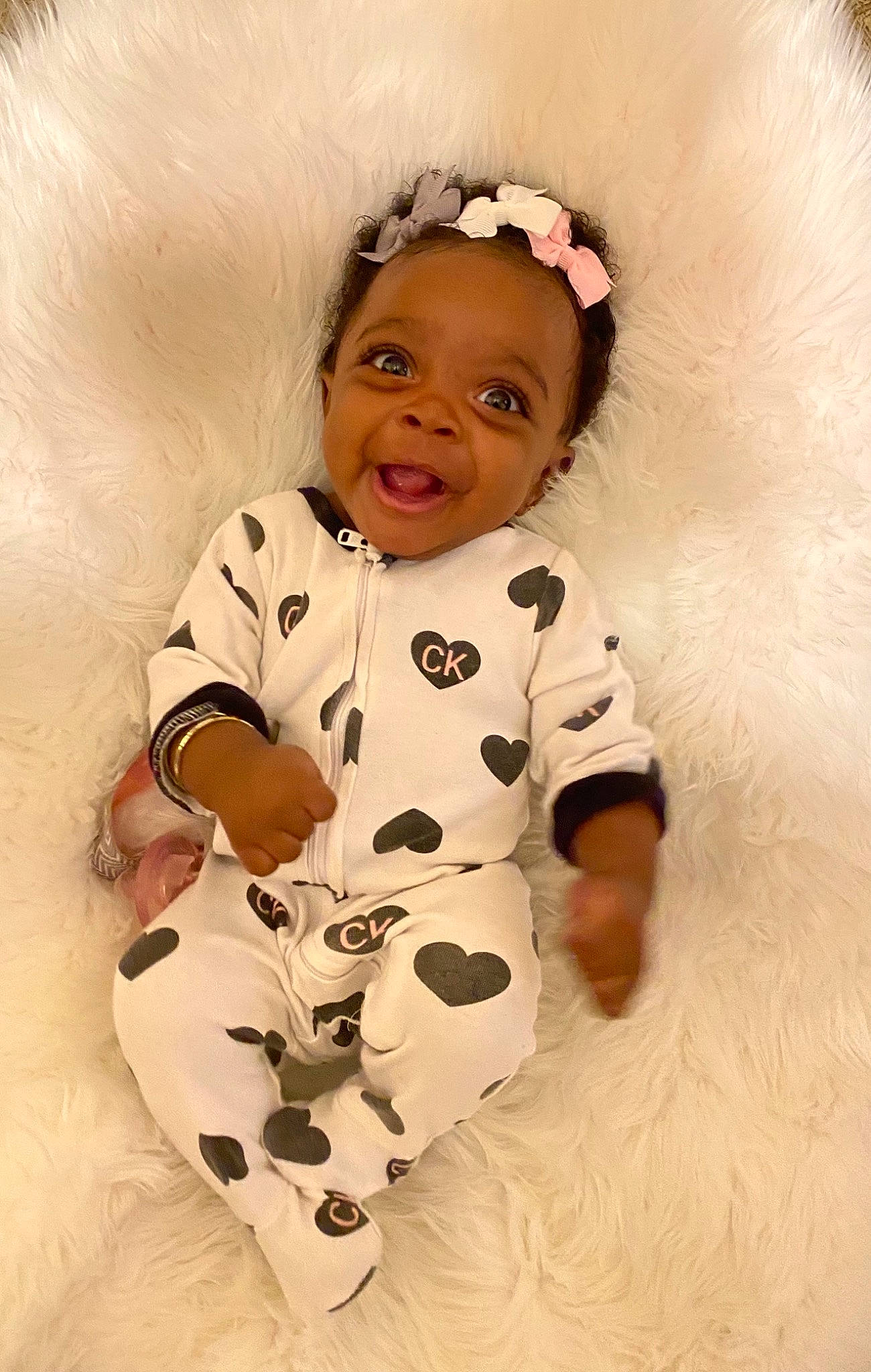 Kaiah joined the competition — help win amazing prizes! arm, baby, baby_toddler_clothing, cheek, child, comfort, eye, finger, fur, happy, hat, headband, iris, lip, pattern, person, skin, sleeve, smile, textile