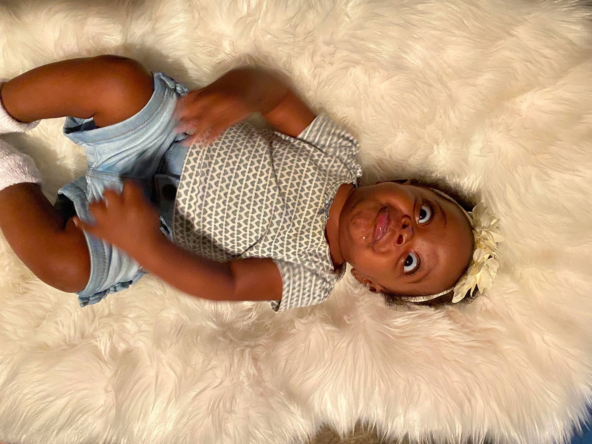 Kaiah is registered to the contest to win money with this photo: abdomen, arm, bed, child, comfort, companion_dog, couch, elbow, fawn, fun, fur, fur_clothing, happy, human_leg, linens, muscle, person, room, skin, smile