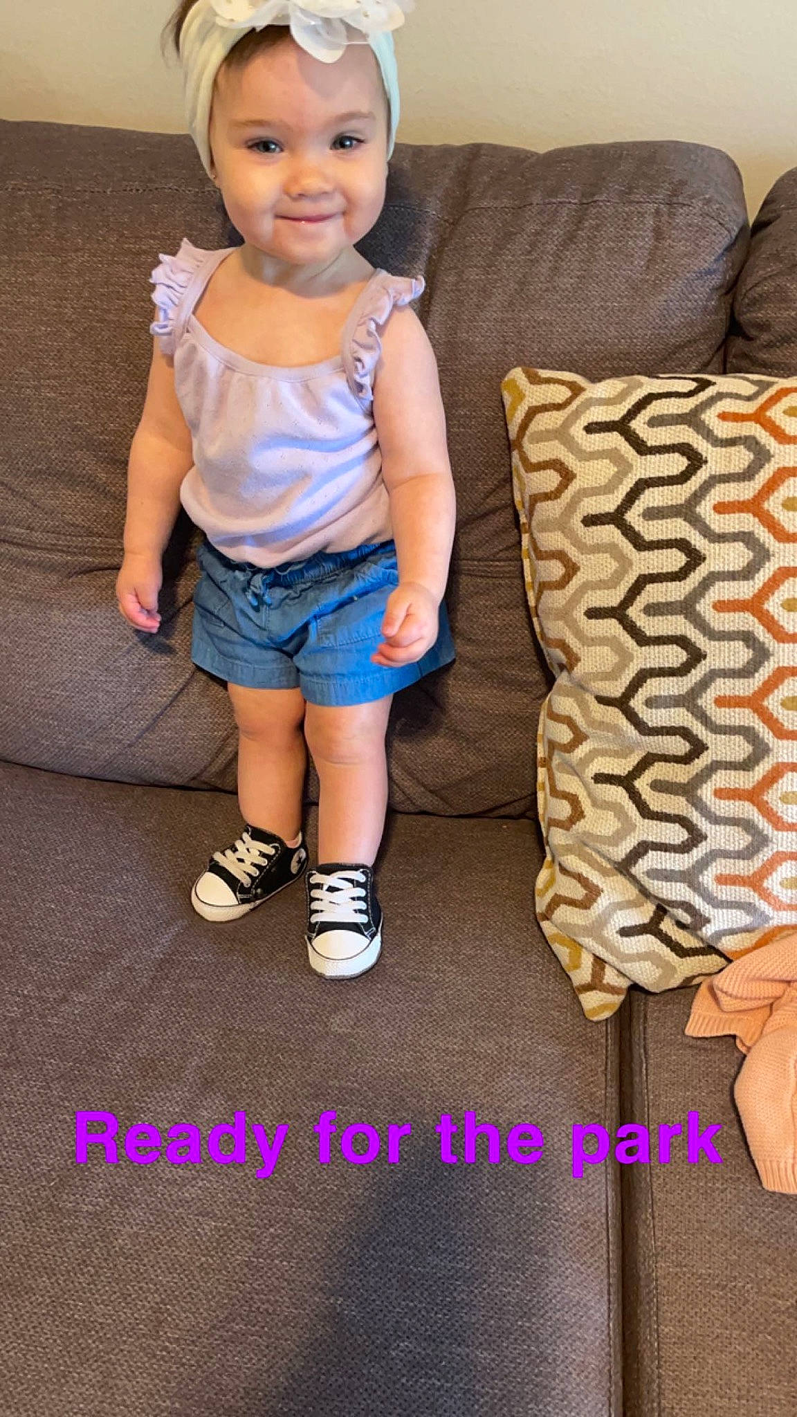 Audree is registered to the contest to win money with this photo: baby_toddler_clothing, child, denim, electric_blue, flooring, fun, hairstyle, happy, human_leg, joy, leg, pattern, person, shoe, shorts, sitting, sleeve, smile, sock, t_shirt