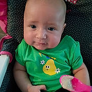 Aurora is registered to the contest to win money with this photo: baby, child, clothing, cute, face, feeding, food, green_shirt, high_chair, indoor, infant, messy_face, minnie_mouse, pear_cartoon, person, polka_dot, seat, smile, spoon, toy