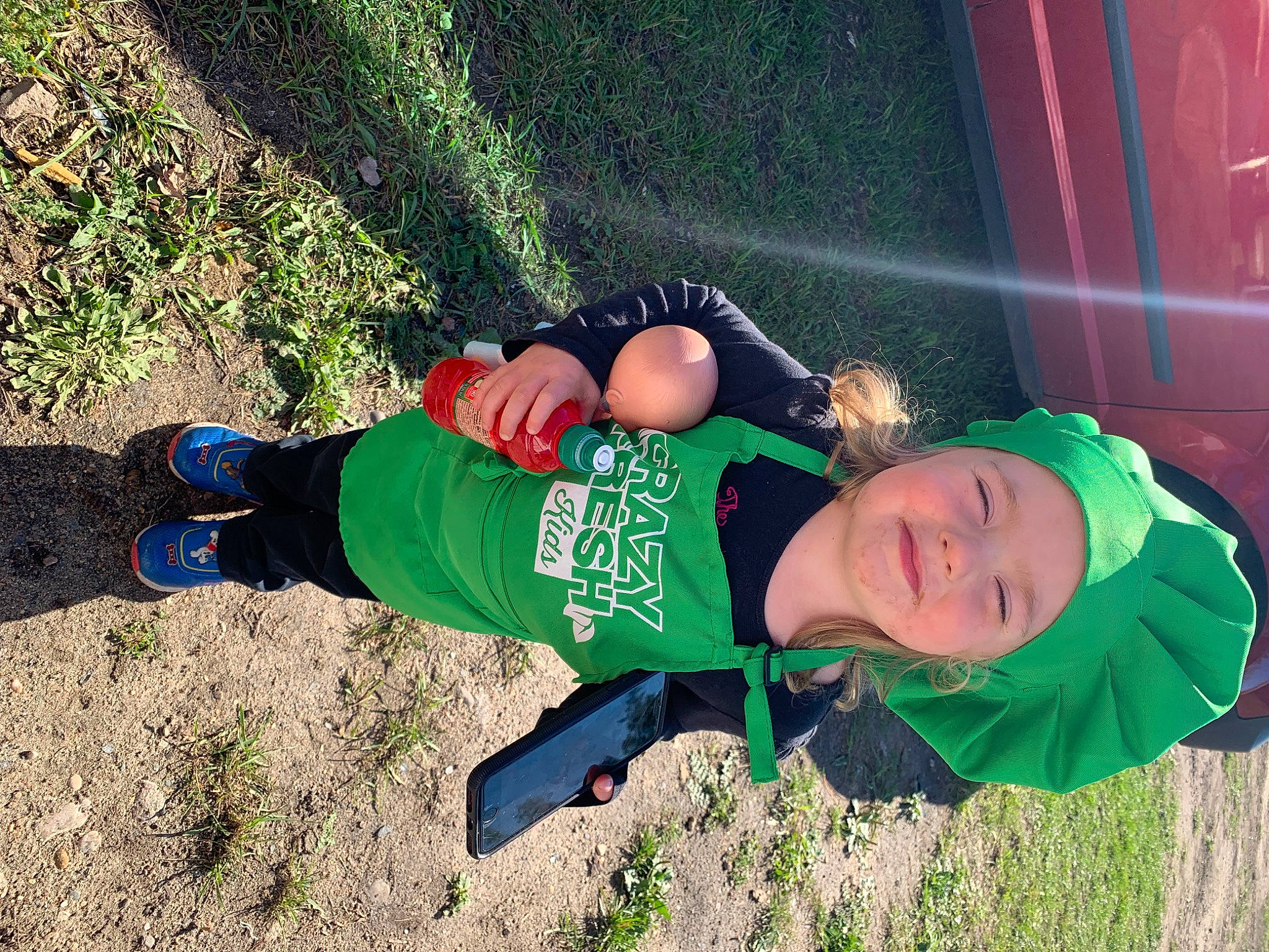 Paislee is registered to the contest to win money with this photo: child, electric_blue, fun, grass, happy, hat, headwear, leisure, people_in_nature, person, personal_protective_equipment, play, recreation, smile, sock, soil, toddler, tree, walking_shoe, winter