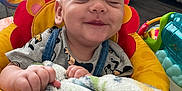 Isaiah is registered to the contest to win money with this photo: baby, baby_seat, blanket, child, clothing, colorful, comfort, cushion, face, floor, furniture, hand, happy, home, indoor, infant, person, play, smiling, toy
