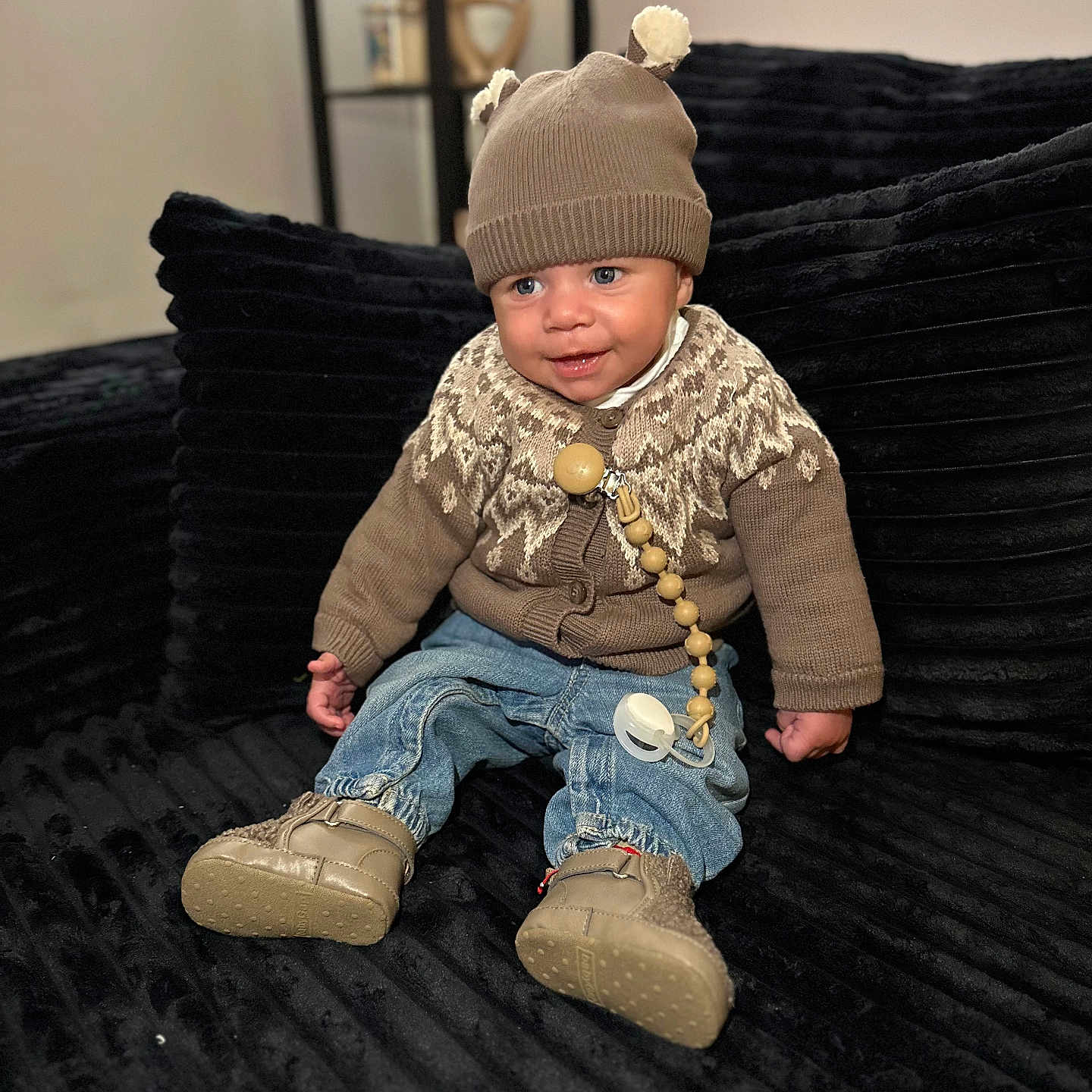 Milan joined the competition — help win amazing prizes! accessories, baby, cap, clothing, couch, face, footwear, furniture, hat, head, jeans, jewelry, knitwear, pants, person, photography, portrait, shoe, sitting, sweater