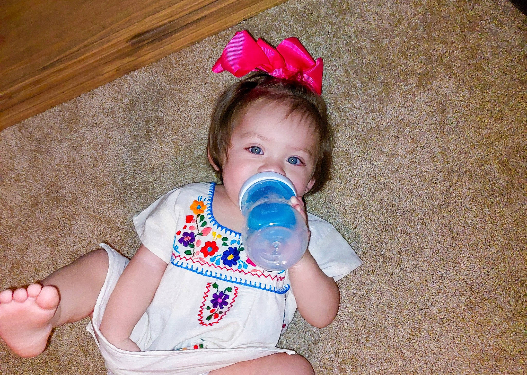 Addy is registered to the contest to win money with this photo: baby, baby_bottle, baby_toddler_clothing, cheek, child, drinkware, eye, face, finger, fun, hairstyle, happy, head, iris, nail, pattern, person, plastic_bottle, skin, thumb