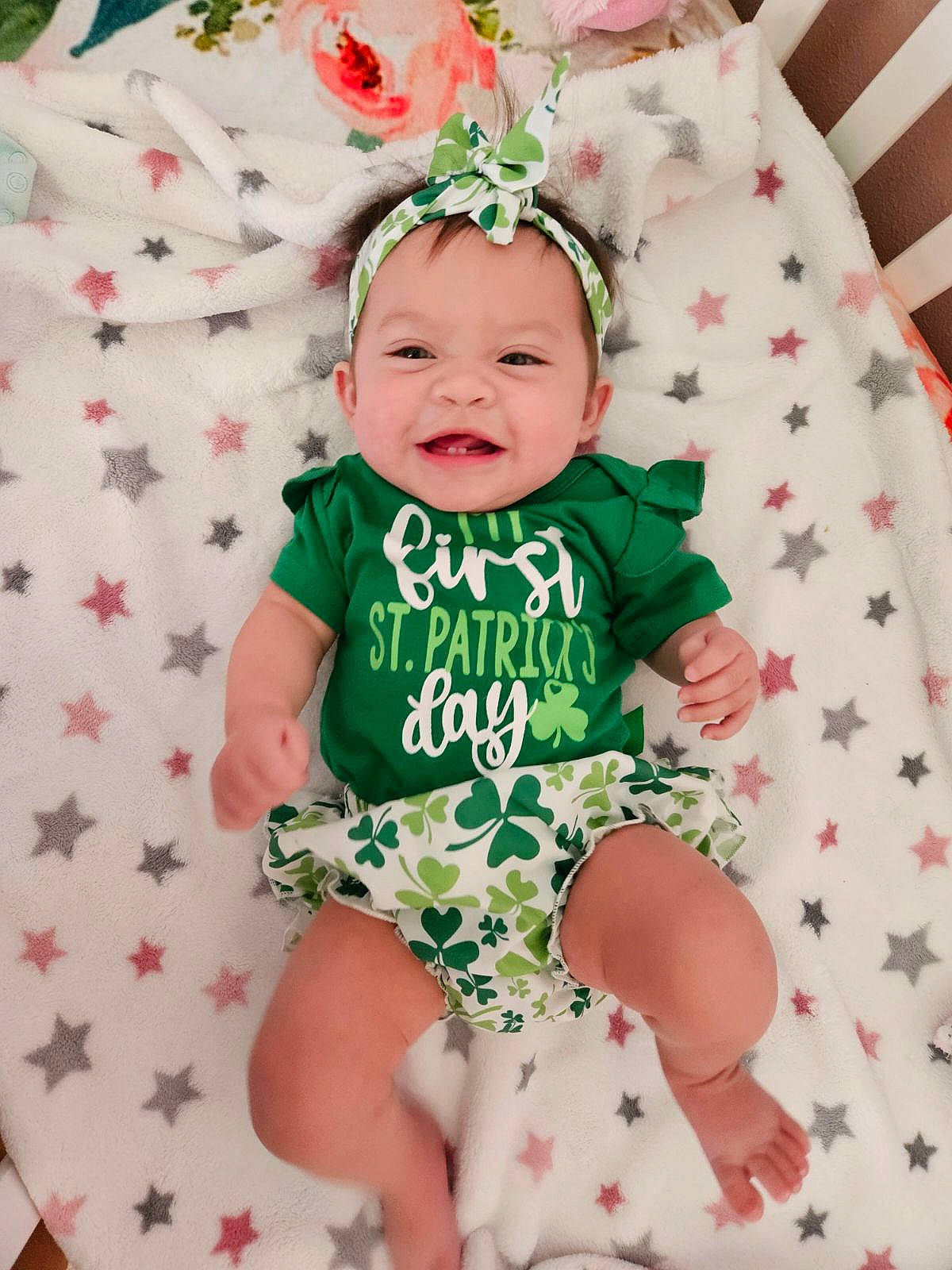 Addy is registered to the contest to win money with this photo: baby, baby_toddler_clothing, child, costume_hat, dress, event, face, grass, green, happy, hat, headgear, headwear, joy, linens, pattern, person, pink, sleeve, smile