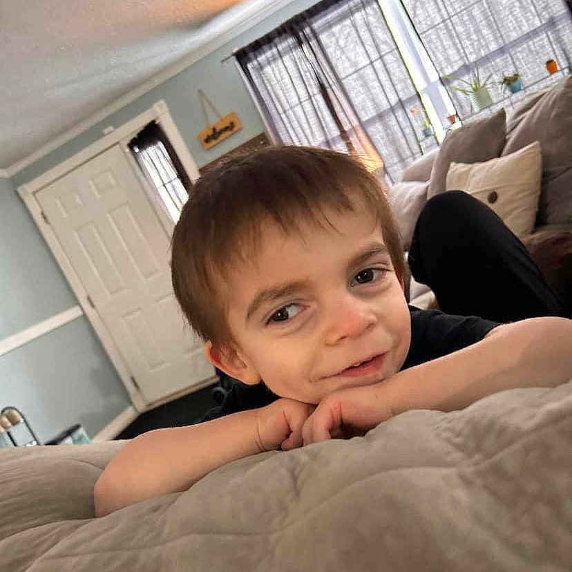 Jackson joined the competition — help win amazing prizes! baby, bed, bedroom, blanket, brownhair, face, furniture, hair, happy, head, hiding, homedecor, indoors, interiordesign, person, photography, portrait, room, sad, smile