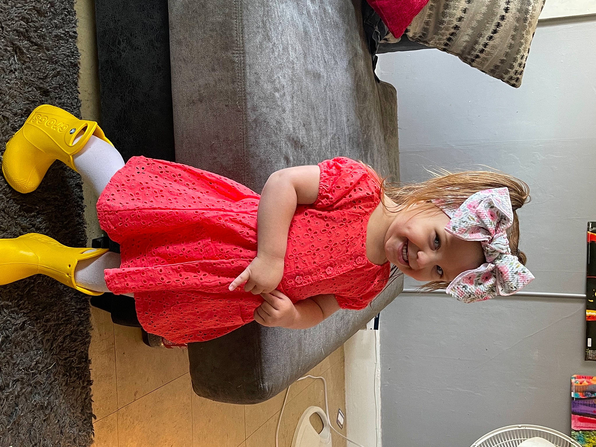 Adley joined the competition — help win amazing prizes! arm, curtain, dress, fun, hand, happy, headwear, human_body, human_leg, joint, joy, knee, leg, leisure, magenta, person, pink, red, sandal, sitting