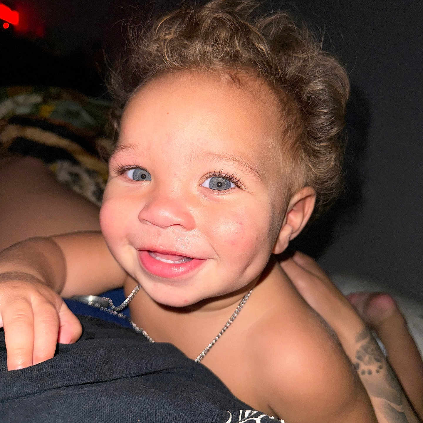 Rylo is registered to the contest to win money with this photo: accessories, baby, blonde, bodypart, face, finger, hair, hand, happy, head, jewelry, laughing, mouth, necklace, person, photography, portrait, skin, smile, tattoo