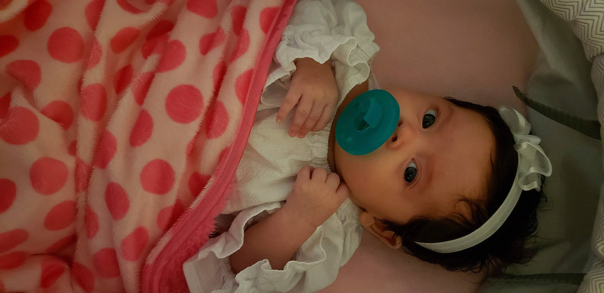 Alaska is registered to the contest to win money with this photo: baby, baby_products, baby_toddler_clothing, child, eye, linens, peach, person, toddler