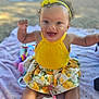 Ocean-Ray joined the competition — help win amazing prizes! baby, child, smiling, yellow_clothing, headband, outdoor, blanket, pacifier, toys, happy, sitting, feet, arms, curly_hair, skirt, floral_pattern, closeup, daylight, face, person