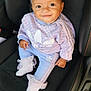 baby, child, smile, headband, bow, curly_hair, adidas, socks, car_seat, clothing, pastel_colors, cute, portrait, sitting, young_child, fashion, happy, indoor, person, footwear