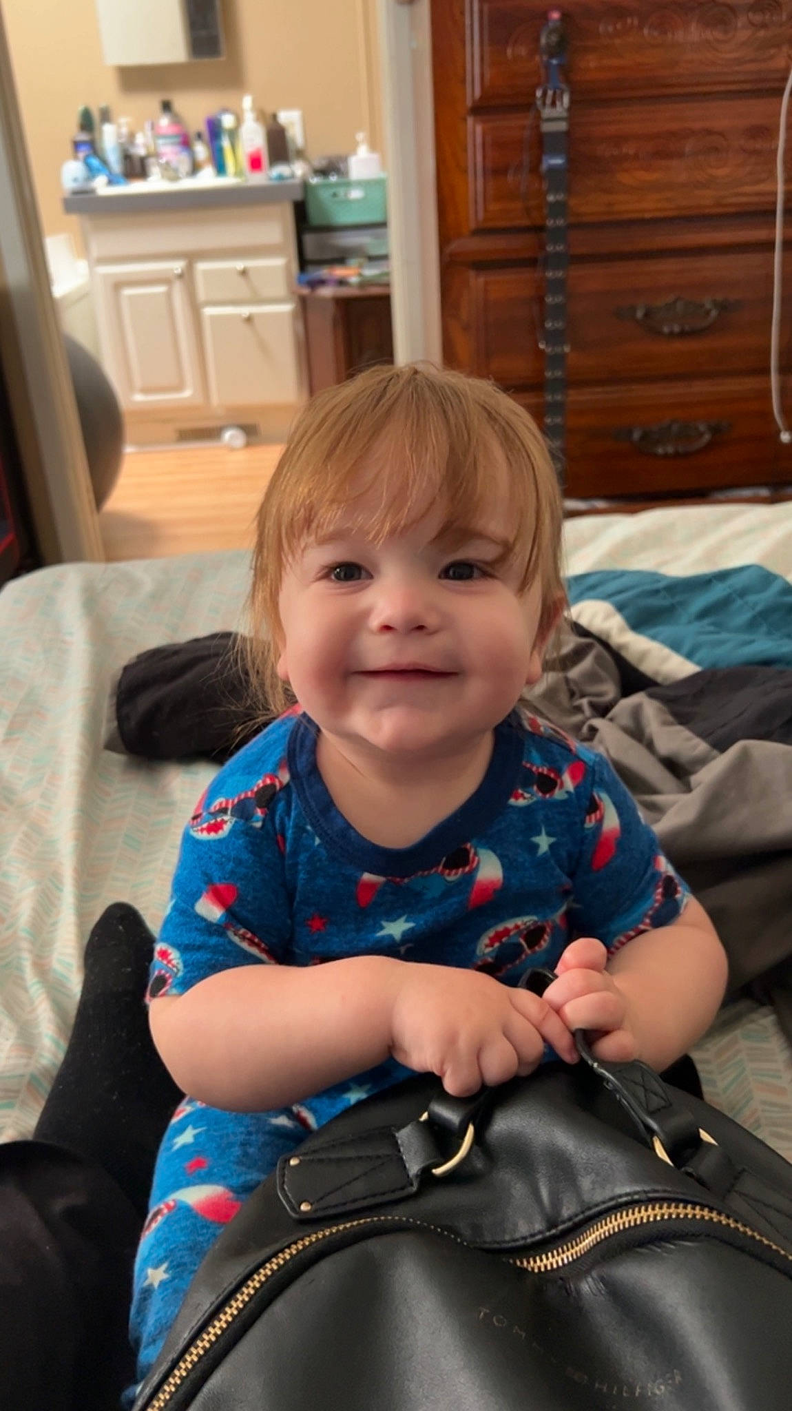 Dakota is registered to the contest to win money with this photo: baby_toddler_clothing, cabinetry, cheek, chest_of_drawers, child, comfort, drawer, electric_blue, event, eye, fun, happy, iris, joy, lap, person, sitting, skin, sleeve, smile