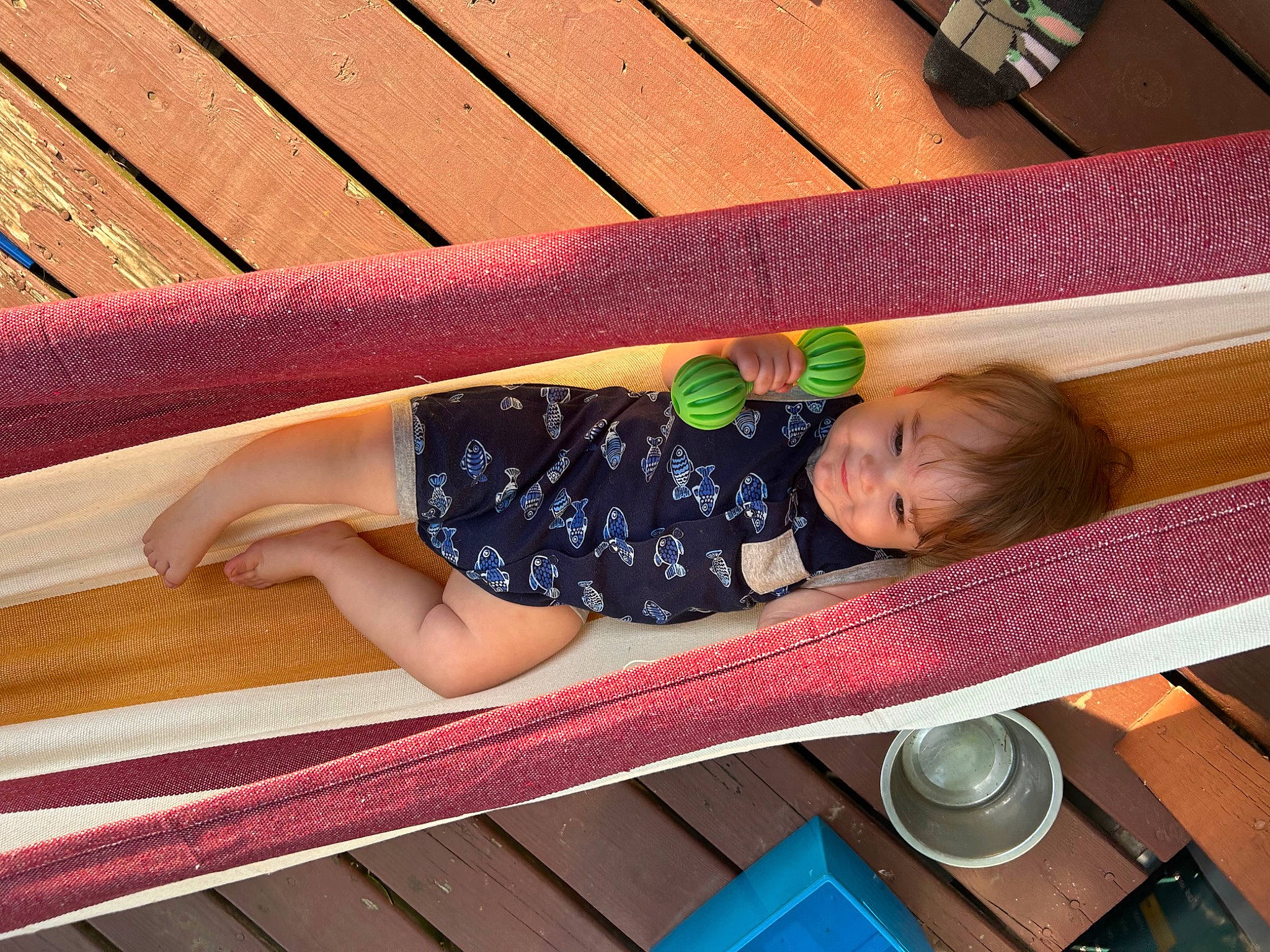 Dakota is registered to the contest to win money with this photo: baby, baby_products, baby_safety, baby_toddler_clothing, child, comfort, flooring, foot, fun, hardwood, human_leg, leisure, outdoor_furniture, pattern, person, plank, sitting, thigh, toddler, wood