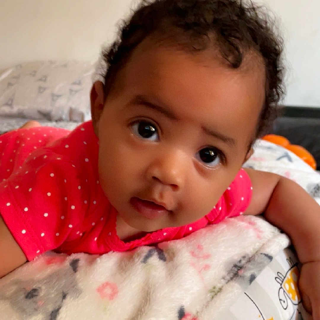 Ayla joined the competition — help win amazing prizes! baby, bed, bedroom, blanket, clothing, cushion, face, furniture, happy, head, homedecor, indoors, newborn, person, photography, portrait, quilt, room, smile, tape