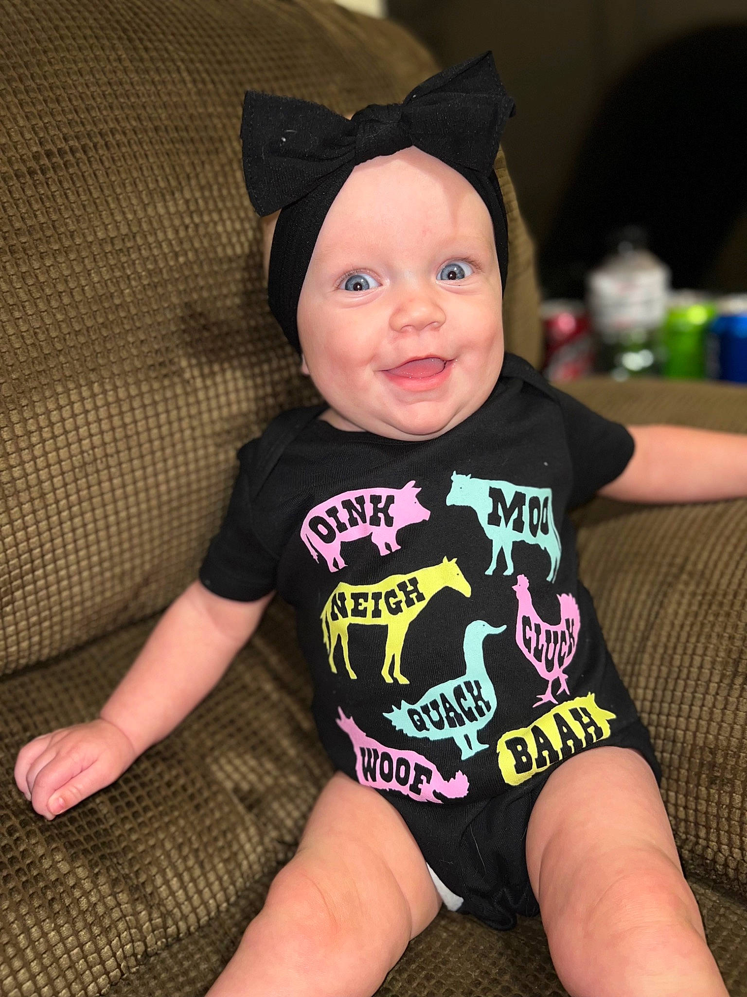 Blakelyn is registered to the contest to win money with this photo: baby, baby_toddler_clothing, barefoot, child, comfort, eye, finger, foot, fun, happy, head, headwear, human_leg, knee, person, skin, sleeve, smile, t_shirt, thigh