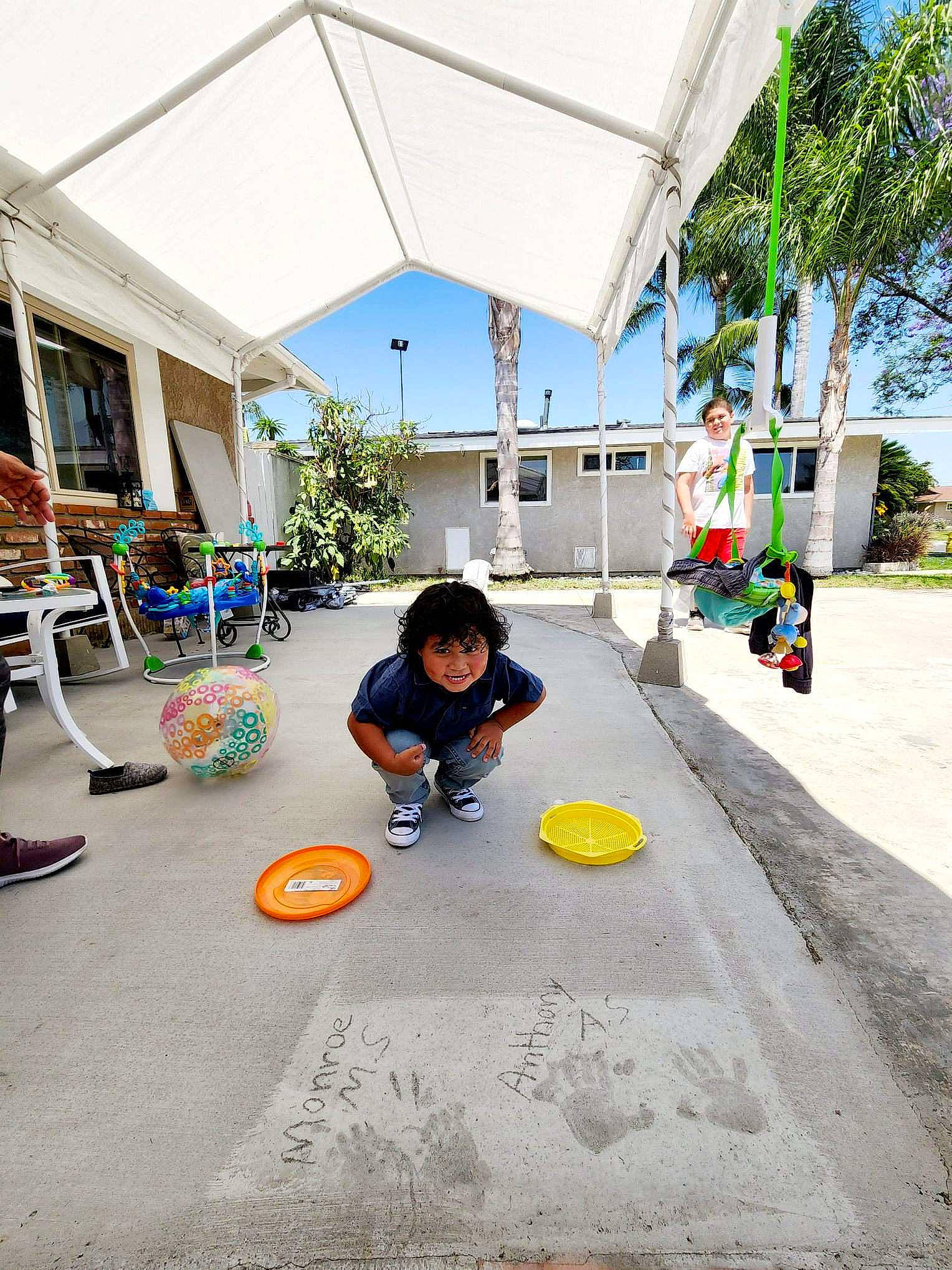 Anthony is registered to the contest to win money with this photo: asphalt, building, city, concrete, floor, flooring, fun, house, joy, leisure, person, plant, recreation, road, road_surface, shade, sidewalk, sky, street, tree