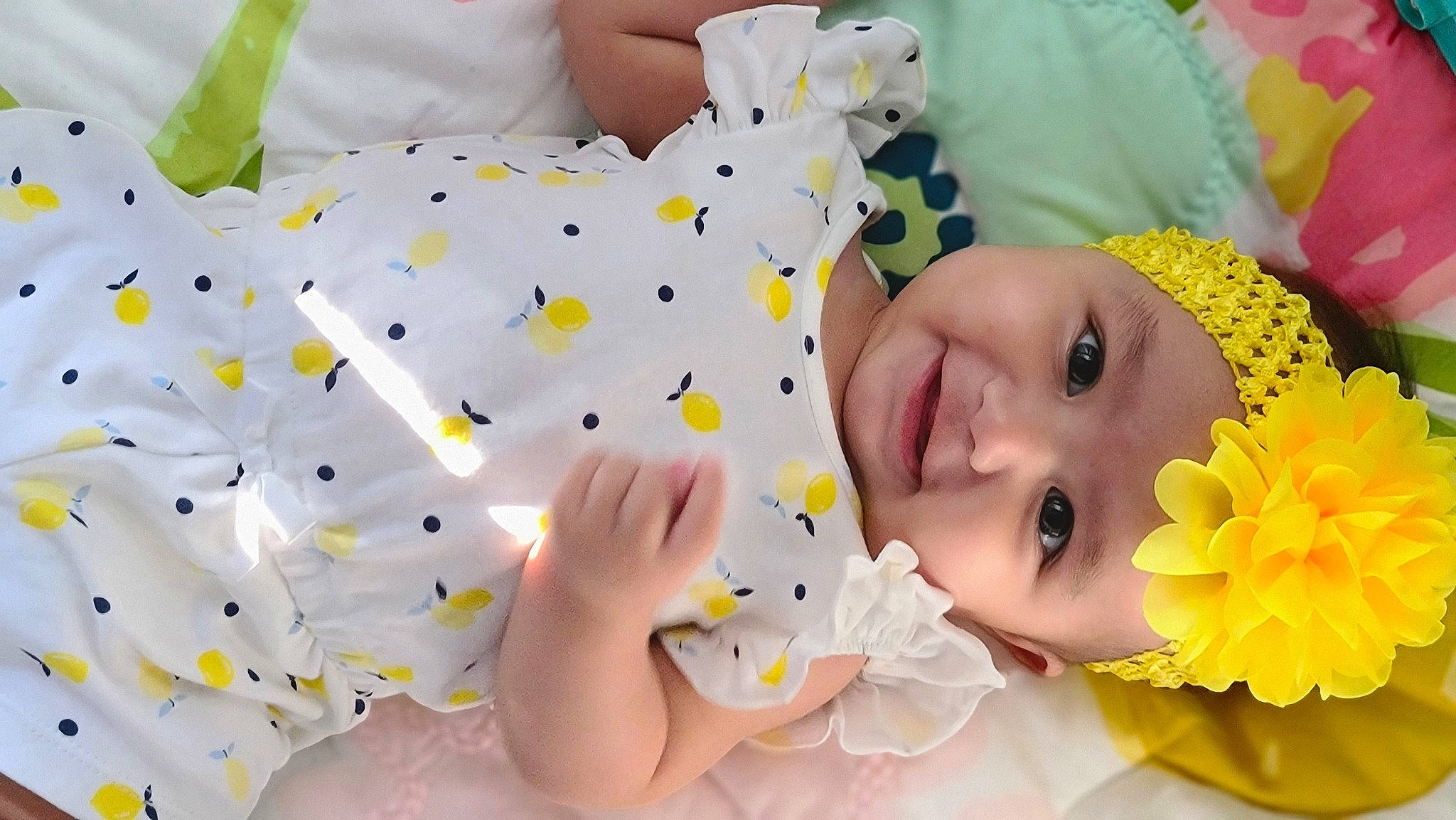 Monroe is registered to the contest to win money with this photo: baby, baby_products, baby_toddler_clothing, cheek, child, finger, flower, happy, headwear, linens, nail, nose, person, petal, play, room, skin, smile, sweetness, toddler