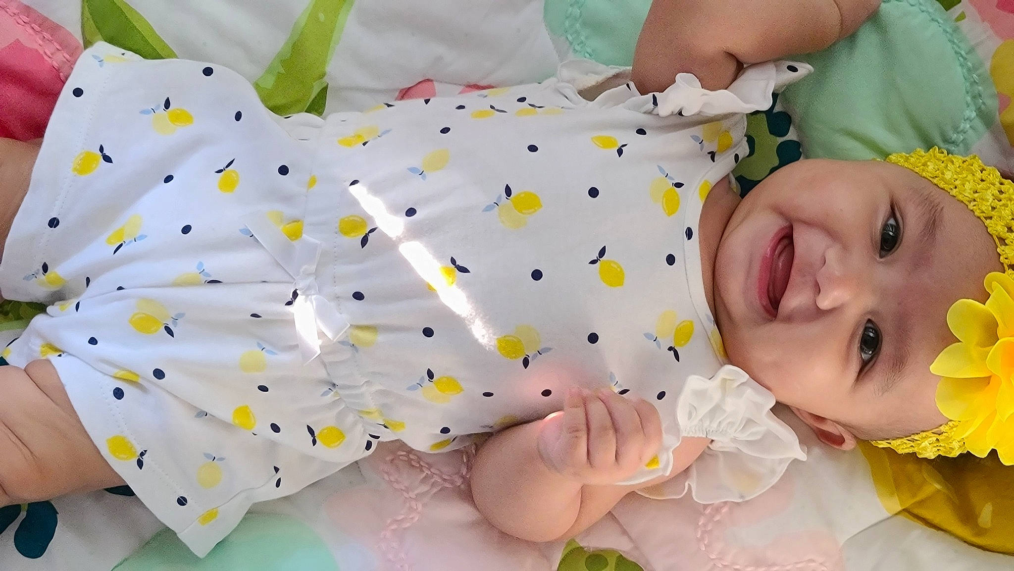 Monroe joined the competition — help win amazing prizes! arm, baby, baby_toddler_clothing, child, dress, finger, green, hand, happy, headwear, human_body, nose, people_in_nature, person, pink, plant, skin, smile, textile, toddler