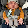 Adam joined the competition — help win amazing prizes! baby, infant, car_seat, child, clothing, hat, pacifier_clip, straps, sitting, closed_eyes, cute, mustard_hoodie, gray_hat, seatbelt, car_safety, small_hands, face, portrait, indoors, young_child