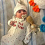 Jase joined the competition — help win amazing prizes! baby, infant, pacifier, onesie, hat, blanket, plush_toy, stuffed_animal, clip, hearts_pattern, white_clothing, lying_down, wide_eyes, surprised_expression, cozy, nursery, soft_texture, red_hearts, striped_blanket, newborn