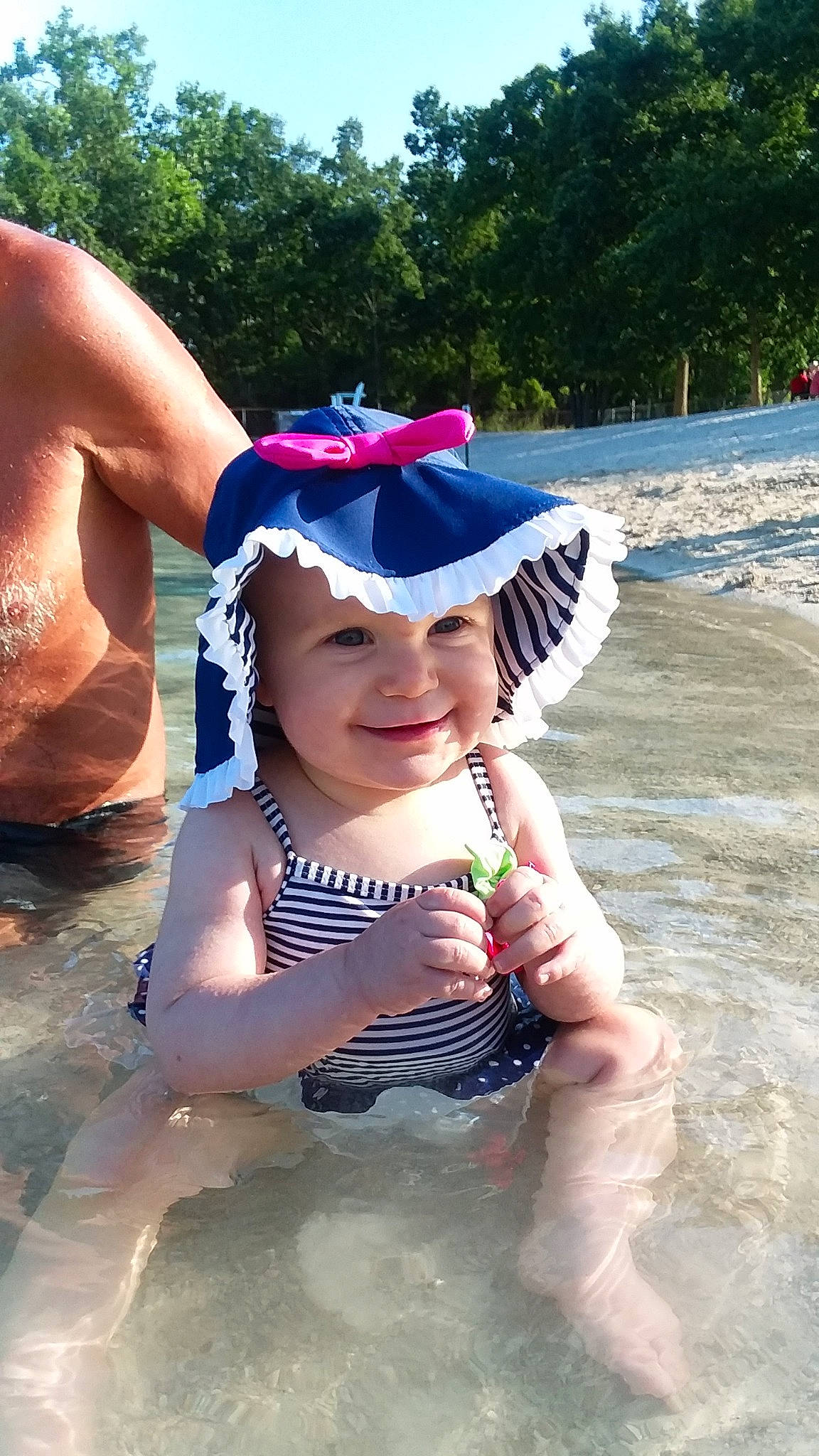 Wrenleigh is registered to the contest to win money with this photo: cap, child, cool, fun, hat, headgear, joy, leisure, person, play, summer, sun_hat, toddler, vacation, water