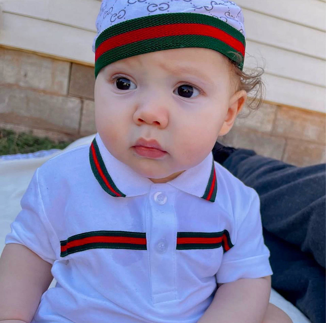 Greysen is registered to the contest to win money with this photo: baby, baby_toddler_clothing, cap, cheek, chin, clothing, collar, cool, dress, eye, happy, head, headgear, headwear, lip, outerwear, person, red, skin, sleeve