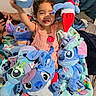 Isamary Sepulveda is registered to the contest to win money with this photo: alien_toys, ball, bed, blanket, blue_toys, child, colorful, couch, dress, family, happy, indoor, playtime, plush_toys, portrait, sitting, smiling, stuffed_animals, toddler, toy_collection