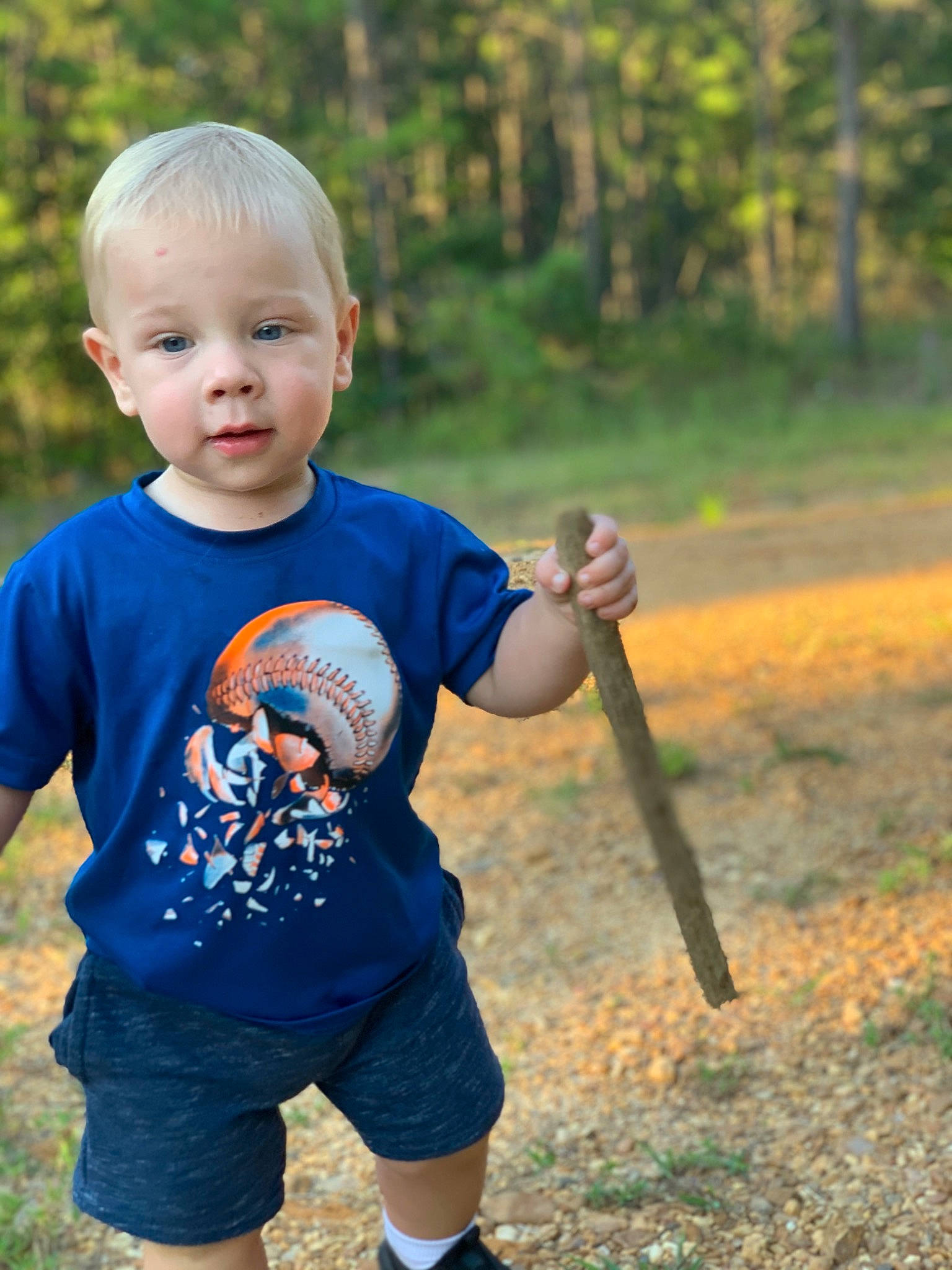 Ben is registered to the contest to win money with this photo: baby_toddler_clothing, clothing, facial_expression, fun, grass, happy, leisure, people_in_nature, person, plant, recreation, shorts, shoulder, sleeve, smile, standing, summer, t_shirt, toddler, tree